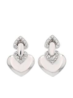 circa 1990s 18kt white gold polished finish heart motif pavé-set white diamonds clip-on design These earrings come as a pair. Normal everyday use and external agents may reduce the lustre of gemstones and gold surfaces. To maintain, use specific, non-abrasive products specially meant for cleaning jewellery. Condition: GOOD. This previously owned and used item is in good condition with minimal signs of use. This may include fading of material or plating and scratches. Purchasing this item continues its narrative and reduces the environmental impact by avoiding the use of new resources needed to make the product from scratch, such as water, materials and electricity, and avoiding additional manufacturing impact. Learn more about what makes a product Conscious on our Conscious Criteria page White Gold Clip-on Earrings With Diamond Accents, White Gold Diamond Clip-on Earrings With Diamond Accents, Luxury Heart-shaped Diamond Earrings, Silver Luxury Clip-on Diamond Earrings, Elegant Diamond White Heart Earrings For Formal Occasions, Luxury Heart Earrings With Diamond Accents For Formal Occasions, Luxury Heart Cut Diamond Earrings For Formal Occasions, White Gold Clip-on Diamond Earrings In Sterling Silver, White Gold Sterling Silver Clip-on Diamond Earrings