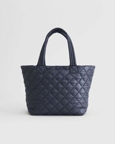 Transit Quilted Carry-All Tote Navy Nylon Bags For On-the-go, Versatile Quilted Bag For Outdoor, Navy Nylon Bag With Pockets, Functional Navy Bag With Zipper Pocket, Navy Nylon Bags With Zipper Closure, Functional Quilted Bag For Daily Use, Functional Navy Shoulder Bag With Zipper, Functional Navy Shoulder Bag With Zipper Closure, Functional Quilted Outdoor Bag