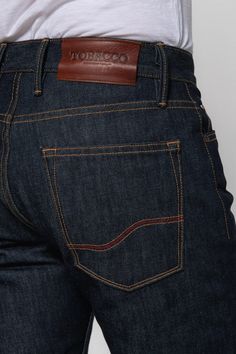 Dillon Jeans - 15oz Selvedge Denim - Indigo - Tobacco Motorwear Luxury Men's Jeans With Frayed Hem, Luxury Men's Jeans With Hip Pockets, Luxury Rugged Rigid Denim Jeans, Luxury High Rise Men's Jeans, Luxury Selvedge Medium Wash Jeans, Luxury Rigid Denim Men's Bottoms, Luxury Rigid Denim Men's Pants, Luxury Dark Wash Selvedge Denim Jacket, Luxury Rigid Denim Pants For Men