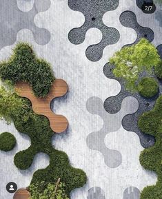 an aerial view of some trees and plants in the shape of people's heads