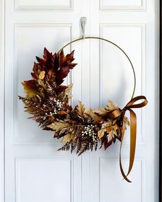 a wreath is hanging on the front door