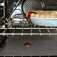 a pie in an oven with the door open to show it's baking inside