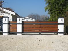 a house with a wooden fence in front of it