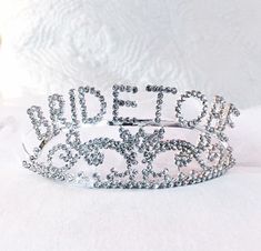 "Beautiful Bride to Be tiara for your engagement shower, bachelorette party or Girl's Night Out! Bachelorette Party Headband | Bride to Be tiara | Crown for Bachelorette This bride to be tiara is the height of glamour and celebration. It's a keepsake every bride will wear and treasure. Pretty, sparkly, for the \"bride to be\". Perfect for the Bachelorette party This is the perfect accessory for that special bride who wants a little extra bling. the headband is metal with rhinestone accents it is Princess Style Wedding Crown, Wedding Crown With Structured Princess Style, Princess Style Wedding Crown With Structured Shape, Princess Style Wedding Crown With Structured Design, Princess Style Structured Crown For Wedding, Adjustable Princess Crown For Wedding, Adjustable Silver Bridal Accessories For Bridal Shower, Adjustable Wedding Crown, Adjustable Silver Wedding Crown