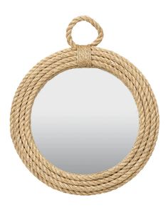 a round rope mirror hanging on a wall