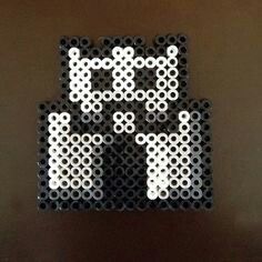 a pixel art piece made out of black and white circles with an image of darth vader on it