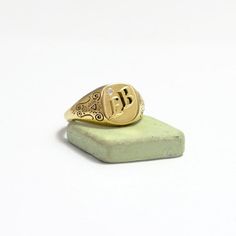 "The initial signet ring is a classic piece of jewellery for both men and women. Bring a little bling with this unique square shaped initial signet ring in 14k gold and 0.05 diamond setting with your choice of initial letters made especially for you. The monogram seal ring is polished to a high finish and decorated with delicate ornamental design that will certainly be noticed as a refreshing element in any day or night outfit. This monogram ring is a perfect gift for a birthday, anniversary, as Antique Signet Ring With Initials For Anniversary, Vintage Adjustable Initial Ring, Antique Personalized Signet Ring For Anniversary, Antique Engraved Ring With Initials For Gift, Vintage Adjustable Engraved Initial Ring, Adjustable Vintage Engraved Initial Ring, Antique Initial Ring With Engraving Option Gift, Victorian Initials Signet Ring For Anniversary, Vintage Adjustable Initial Ring Personalized