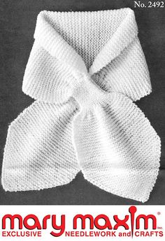 a white knitted bow on top of a black background