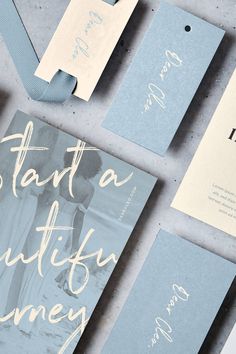 the wedding stationery is laid out on top of each other