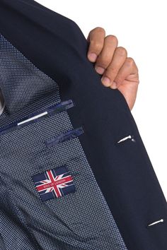 A refined slim fitted suit with a notch lapel and two button closure offers a sophisticated appearance for any occasion. Fit: this style fits true to size. S=short, R=regular, L=longJacket:. Slim fit. Notch lapel. Two button closure. Chest welt pocket. Flap pockets on front. 5 buttons on each sleeve. Side vents. Four interior pockets. Approx. 28" length. ImportedPants:. Flat front. Zip fly with hook-and-bar and button closure. Front slant pockets. Back besom pockets with button closure. Unhemmed Navy Notch Lapel Workwear Sets, Navy Notch Lapel Sets For Workwear, Business Casual Suit With Button Closure, Tailored Business Sets With Pockets, Workwear Suits With Button Closure, Navy Notch Lapel Suit With Button Closure, Tailored Tuxedo Suits With Pockets, Navy Suits With Button Closure For Work, Navy Suits With Pockets