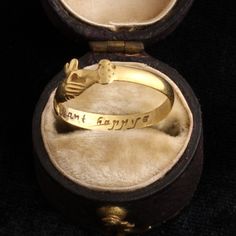 The symbol of two clasped hands is an ancient, sentimental design that has historically been associated with fidelity and marriage. "Fede" rings (from the Italian, for "trust" or "fidelity") or "Gimmel" rings (meaning "twin") were often used as betrothal tokens in 16th and 17th century Europe, but they remained popular until well after the Renaissance. This wonderful 18th century fede ring with a heart emerging from the pair of hands is also a posy ring inscribed with the words "constant happye" Symbolic Engraved Rings For Ceremonial Occasion, Symbolic Ceremonial Engraved Rings, Ceremonial 14k Gold Jewelry With Historical Design, Antique Hand Forged Rings For Ceremonial Occasions, Symbolic Engraved Wedding Ring, Hand Forged Vintage Promise Jewelry, Symbolic Wedding Engraved Ring, Antique Hand Forged Ceremonial Rings, Heirloom Adjustable Engraved Ring For Promise