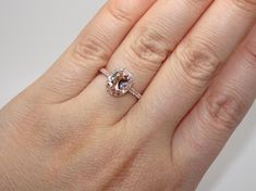 Description: BEAUTIFUL 14K ROSE GOLD LADIES DIAMONDS AND MORGANITE RING. THIS ITEM IS NEW IT COMES WITH GIFT BOX. WE DO OFFER FREE SIZING. IF YOU HAVE ANY OTHER QUESTIONS PLEASE CONTACT US. ALL THE INFO ON THIS ITEM DOWN BELOW. THANK YOU VERY MUCH. KATE . Metal: SOLID 14K ROSE GOLD Stamped: 14K Total Gram Weight: 3.7GR Ring Size: 6.5 (RESIZEBLE) Setting: PRONG WidthTop: 12.6MM Width Bottom: 1.6MM Stones: 100% NATURAL DIAMONDS Color: F Clarity: VS2-SI1 Shape: ROUND BRILLIANT CUT DIAMONDS Total Ca Yellow Gold Morganite Wedding Ring, Oval Morganite Wedding Ring With Brilliant Cut, Oval Morganite Wedding Ring With Rose Cut Diamonds, Morganite Halo Ring For Wedding, Luxury Oval Morganite Wedding Ring With Halo Setting, Oval Morganite Rose Gold Wedding Ring, Oval Morganite Wedding Ring, Oval Rose Gold Morganite Wedding Ring, Wedding Anniversary Ring