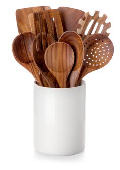 wooden utensils and spoons in a white cup