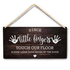 a sign that says, since little fingers touch our floor please leave your shoes at the door