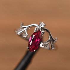 It is a ruby ring. The main stone is 5 mm* 10 mm marquise cut. weight about 1.34 carats. The basic metal is sterling silver and plated with rhodium. To change the metal to a solid gold (white/rose) or platinum is also available, please ask for a quotation if you want. You can also go to my shop Home for more elegant rings: https://www.etsy.com/shop/godjewelry?ref=hdr_shop_menu Alexandrite is June birthstone More alexandrite rings: https://www.etsy.com/shop/godjewelry?ref=seller-platform-mcnav&se Marquise Ruby Ring In White Gold, Marquise White Gold Ruby Ring, White Gold Marquise Ruby Ring, Marquise Ruby Birthstone Ring, Elegant Marquise Ruby Birthstone Ring, Marquise Ruby Gemstone Jewelry, Marquise Ruby Jewelry In White Gold, Marquise Ruby White Gold Jewelry, Elegant Marquise Ruby Jewelry