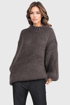 This is a snug knitted sweater that boasts long sleeves and dropped shoulders, creating a laid-back aesthetic. The fit is loose, offering the ultimate in comfort for the wearer. This combination of features culminates in a sweater that is not just a piece of clothing, but a cozy companion for those chilly days.Fabric: Cotton, Polyester Oversized Knitted Sweater, Oversized Knitted Sweaters, Knitted Sweater, Piece Of Clothing, Fabric Cotton, Round Neckline, Knitwear, Long Sleeve, Fabric