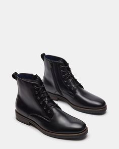 1.25 inch heel height 10.25 inch shaft circumference 5.75 inch shaft height Leather upper material Leather lining Leather sock Rubber sole Imported Steve Madden Store, Apparel Merchandising, Leather Socks, Men's Boots, Rubber Sole, Heel Height, Ankle Boot, Leather Upper, Black Leather