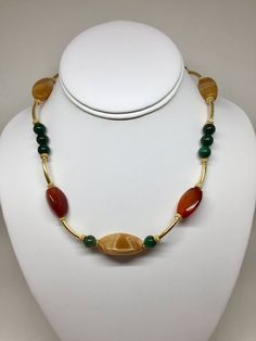 Carnelian, agate and aventurine chunky gold necklace Orange Agate Gemstone Necklace, Bohemian Green Onyx Gold Jewelry, Bohemian Gold Jewelry With Green Onyx, Elegant Orange Agate Necklace, Unique Orange Agate Necklace, Gold Aventurine Beaded Jewelry, Handmade Green Onyx Gold Necklace, Spiritual Gold Jade Beaded Necklace, Spiritual Gold Jade Beaded Necklaces