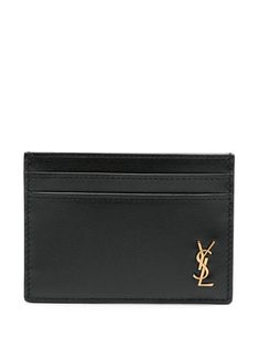 black calf leather smooth grain signature Cassandre logo plaque internal logo stamp open top card slots to the front and rear main compartment leather lining This piece comes complete with a protective dust bag. Luxury Black Wallet With Logo, Business Leather Wallets With Logo, Formal Rectangular Wallet With Logo, Designer Rectangular Wallets With Logo, Luxury Rectangular Wallets With Logo, Luxury Rectangular Wallet With Logo, Designer Business Wallets With Logo, Designer Logo Wallets For Formal Occasions, Designer Business Wallet With Logo