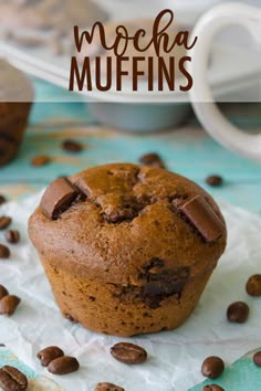 a muffin with chocolate chips on top and the words mocha muffins above it