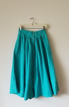 Vintage 1980's size 10 Liz Claiborne skirt. Button-front, yoked with pleats long/peasant/prairie skirt. Ankle length. Sea green. Full and flowy. Cotton fabric does not stretch. Perfect 1980s fashion with ankle boots and socks. Cottage, hippie, boho. 80’s Skirt, Daywear Long Skirt With Buttons, Vintage Full Skirt Bottoms With Buttons, Vintage Green Flared Skirt Bottoms, Vintage Green Long Skirt, Vintage Long Green Skirt, Green Vintage Long Skirt, Vintage Full Skirt With Buttons, Buttoned Full Maxi Skirt