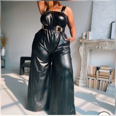 This black, sleeveless vegan leather jumpsuit is flirty, sexy, and all that! Looks great both belted and loose. Featured belt sold separately. Belted Jumpsuits And Rompers For Night Out, Fitted Jumpsuits With Belt Loops For Night Out, Black Faux Leather Jumpsuits And Rompers For Night Out, Black Belted Jumpsuits And Rompers For Evening, Black Belted Jumpsuit For Party, Black Belted Jumpsuit For Evening, Chic Black Jumpsuits And Rompers With Belt Loops, Faux Leather Jumpsuits And Rompers For Party, Black Belted Jumpsuits And Rompers For Fall