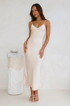 Length from bust to hem of size S: 118cm. Chest 39cm, Waist 33cm, across front only of size S. Midi dress. Semi-lined. Model is a standard XS and is wearing size XS. True to size. Non-stretch. Satin. Back tie. V-neck. Zipper. Cold hand wash only. Polyester. Designed for classy affairs. The Sophisticated Satin Slip Midi Dress features a gorgeous silky satin silhouette, a V-neck and a tie-up detail to the back. For a timeless 'fit style with heels. Feminine Fitted Lined Slip Dress, Fitted Feminine Lined Slip Dress, Fitted Bias Cut Maxi Dress For Brunch, Fitted Bias Cut Midi Dress For Daywear, Fitted Midi Slip Dress For Daywear, Elegant Lined Slip Dress For Brunch, Feminine Fitted Slip Dress, Feminine Fitted Slip Dress For Brunch, Fitted Feminine Slip Dress For Brunch