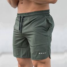 Enhanced with the quick dry feature, these bodybuilding shorts for men give your sports wear a bold and powerful look. Made using acetate and polyester for durability, these loose shorts have a drawstring closure with a letter pattern. Decorated with ruffles to elevate their visual appeal, these casual, gym shorts will keep you comfortable through the day. Order this trendy, knee length pair today!

Specifications
Gender: Men
Item Type: Shorts
Length: Knee Length
Pattern Type: Letter
Material: A Compression Shorts Men, Casual Shorts Men, Pants Male, Fitness Exercises, Moda Streetwear, Streetwear Mode, Short Men Fashion, Seluar Pendek, Fitness Bodybuilding