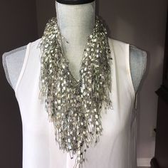 "GOES WITH EVERYTHING! - With the many variegations of cream, white, pearl and opal colors included in this item, this beaded necklace scarf goes with everything. Looks great on black, cream, white and any other color. - Near weightless (0.7 ounces) - Statement piece - Infinity/loop style made from metallic yarns (66 inches in diameter) SHOP FOR MORE COLORS, VISIT https://www.etsy.com/shop/scarfladyfashions View an instructional video HOW TO WEAR THE GEMLACE BY SCARFLADY, visit https://scarflady Bohemian Silver Beaded Necklace With Pearl Chain, Silver Beaded Long Pearl Necklace, Silver Beaded Bohemian Pearl Necklace, Bohemian Silver Beaded Pearl Necklace, Silver Bohemian Pearl Necklace With Beads, Bohemian Pearl Beaded Necklaces In Silver, Bohemian Silver Pearl Beaded Necklaces, Bohemian Pearl Necklace With Polished Beads In Silver, Bohemian Silver Pearl Necklace With Polished Beads