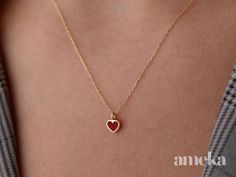 "Embrace simplicity and express your love with our Tiny Red Heart Necklace, a minimalist piece that comes ready to be gifted. This delicate necklace features a tiny red heart, symbolizing love and affection in its purest form. Crafted with a minimalist design, it adds a subtle yet meaningful touch to any outfit. Packaged and ready for gifting, this necklace is perfect for expressing your sentiments on various occasions. Share the gift of love effortlessly with the Tiny Red Heart Necklace, a charming and timeless accessory. * SHIPPING & PROCESSING * This design is ready to ship in 1 - 10 business days. Our turnaround time is about 3 - 7 business days for custom-made designs. This can change during peak seasons. * RETURNS We offer returns if you're not happy with your purchase! Please contac Minimalist Red Heart-shaped Jewelry, Dainty Red Jewelry For Everyday, Minimalist Red Heart Necklace, Delicate Red Jewelry For Valentine's Day, Delicate Red Valentine's Day Jewelry, Red Dainty Charm Necklace With Heart Charm, Dainty Red Charm Necklace For Valentine's Day, Dainty Red Charm Necklace For Everyday, Red Heart Pendant Necklace For Everyday