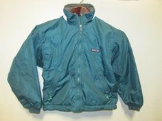 Patagonia Teal Squall Fleece Lined Kids Jacket  NYZ25 Kids 10 Good condition Cuff: knit rib Name written in name tag Flat measurements approx: Shoulder: Shoulder seam to shoulder seam: 18" Chest: Pit to pit: 10.5" Sleeve:Shoulder seam to sleeve cuff: 19.5" Back length: 22" Conversion from inches to centimeters: 1 in. = 2.54 cm. Notice: All International buyer purchases shall be shipped with tracking. International shipping is additional, no return.  Contact seller for more detail. Allow me to he Patagonia Windbreaker For Winter Hiking, Patagonia Long Sleeve Outerwear, Patagonia Green Long Sleeve Outerwear, Green Long Sleeve Patagonia Outerwear, Green Long Sleeve Outerwear By Patagonia, Long-sleeve Patagonia Windbreaker For Winter, Patagonia Winter Windbreaker, Patagonia Green Outerwear For Fall, Green Patagonia Outerwear For Fall