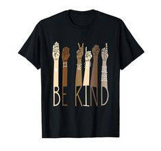 a black t - shirt with the words be kind written in different colors on it