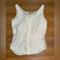 Nwt New York Studio Silk White Sleeveless Button-Down Top - Small. Brand New. Never Worn. 100% Silk. Lightweight, Soft, Silky & Luxurious. Excellent Condition. Pet Friendly And Smoke Free Home. Bundle For Best Deal. All Sales Are Final. No Returns Or Exchanges. Sleeveless Tops With Snap Buttons For Work, White Sleeveless Top With Buttons, White Buttoned Tank Top, Classic Summer Tank Top With Buttons, White Sleeveless Buttoned Top, Classic Sleeveless Summer Camisole, Sleeveless Spring Tops With Snap Buttons, Classic Sleeveless Camisole For Summer, Sleeveless Tops With Snap Buttons For Spring