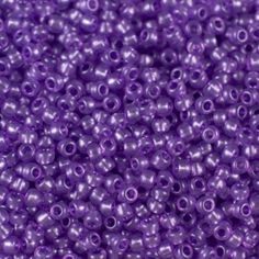 purple seed beads are shown in close up