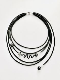 Shades of Gray Jewelry by Dagmara Costello (Rubber & Stone Jewelry) | Artful Home Modern Black Jewelry With Sterling Silver Clasp, Adjustable Multi-strand Modern Jewelry, Modern Adjustable Single Strand Necklace, Contemporary Adjustable Black Jewelry, Grey Necklace, Grey Jewelry, Asymmetrical Necklace, Morse Code Necklace, Gray Necklace