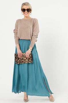 Flowy Elegant Rayon Skirt, Chic Stretch Maxi Skirt For Day Out, Elegant Maxi Skirt With Elastic Waistband For Day Out, Chic Maxi Skirt With Elastic Waistband For Day Out, Flowy Rayon Maxi Skirt, Chic Flowy Rayon Maxi Skirt, Chic Lined Maxi Skirt, Chic Maxi Length Skirt For Spring, Chic Solid Color Maxi Skirt With Lining