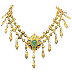 Moroccan Gold Emerald Necklace Center Enamel Moroccan Pendant made Circa 1850 set on a later 14k gold necklace Reverse set with enamel Gold Type: 14K Yellow Gold Measurements: 14.5" long Gram Weight: 51.2 Grams Yellow Gold Enamel Medallion Necklace, Antique Yellow Gold Jewelry With Meenakari, 22k Gold Victorian Ceremonial Jewelry, Antique 22k Gold Meenakari Jewelry, Vintage Gold Jewelry With Meenakari, Gold Enamel Necklace With Cabochon, Vintage Gold Meenakari Jewelry, Gold Enamel Necklaces With Cabochon, Engraved Yellow Gold Necklace With Enamel