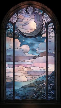 a stained glass window with clouds and stars