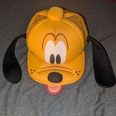 Pluto Hat With Ears From Disney World!! Never Worn, In Great Condition (Nwot) No Reasonable Offer Refused!! Thanks For Shopping My Closet!! Fun Mickey Mouse Themed Hat One Size Fits Most, Fun Mickey Mouse Hat, Playful Yellow Baseball Cap, Disney Gear, Jack Skellington Faces, Mickey Mouse Ears Hat, Hat With Ears, Disney Hats, Logo Yellow