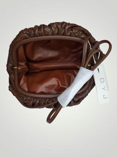 The DYJ Small Dumpling Bag brings style and function together. This luxurious bag features a coffee brown exterior, crafted from quality PU leather. The interior is fully lined and has plenty of space to store your everyday essentials. A modern strap make it easy to carry, making it perfect for everyday use. Coffee Brown Small Dumpling Bag Cross Body New With Tags Free Shipping in the US Boutique Adventures in an online retail store located in Aurora, MO. We specialize in Boutique, Bargain, and Wholesale Retail Sales. This item is liquidated merchandise from your favorite retail store. Brown Soft Leather Clutch Bag, Brown Faux Leather Pouch Shoulder Bag, Brown Clutch Shoulder Bag With Detachable Strap, Brown Clutch Shoulder Bag For Travel, Brown Leather Top Handle Hobo Bag, Brown Leather-lined Top Handle Hobo Bag, Brown Hobo Bag With Detachable Strap, Brown Hobo Bag With Top Handle And Removable Pouch, Brown Pouch Shoulder Bag With Detachable Handle