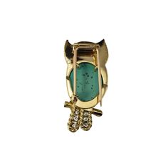 Vintage Cartier 18K Turquoise, Emerald and Diamond Owl Brooch  This exquisite brooch by Cartier features a cabochon turquoise body, cabochon emerald eyes and 6 round brilliant cut diamonds in its tail.  Set in beautifully detailed textured 18K yellow gold. Circa 1960's.  Approximate total diamond weight: .30 ct.  Diamond color: G  Diamond clarity: VS1  Size: 45 mm x 21 mm  Weight: 13.9 dwt./ 21.7 gr.  Hallmark:  CARTIER 18K   Very good condition, professionally polished.  Will come packaged in a gift box or pouch (when possible) and will be shipped U.S. Priority Mail Insured. Turquoise Brooch For Formal Occasions, Luxury Turquoise Brooches For Gift, Luxury Turquoise Brooches, Turquoise Branding, Emerald Eyes, Georg Jensen, Gold Brooches, Pearl Brooch, Diamond Clarity