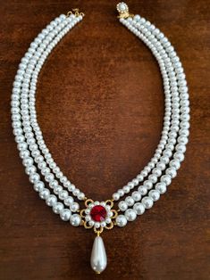 Elegant White Ruby Necklace, Elegant Red Pearl Necklace, Red Pearl Chain Necklace For Wedding, White Ruby Bridal Necklace For Celebration, Elegant Red Pearl Jewelry, Elegant Red Pearl Necklace For Weddings, Elegant Red Pearl Necklace For Formal Occasions, White Ruby Necklaces For Wedding, Elegant Red Pearl Drop Necklace