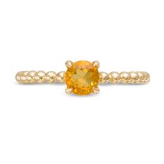 Dainty and feminine, this gemstone ring sets an elegant tone. Crafted in warm 10K gold, this style features a 5.0mm golden yellow citrine centered on a sculpted beaded shank. Polished to a bright shine, this ring appeals to her divine taste. 14k Gold Jewelry With Yellow Gemstone Accents, Yellow 14k Gold Jewelry With Gemstone Accents, Gold Yellow Sapphire Rings With Gemstone Accents, Yellow Gold Rondelle Birthstone Jewelry, Yellow Sapphire Jewelry With Accent Stones In Yellow Gold, Yellow Gold Jewelry With Yellow Sapphire And Accent Stones, Yellow Gold Citrine Birthstone Jewelry, Faceted Citrine Promise Ring Jewelry, Fine Jewelry Citrine Necklace With Center Stone