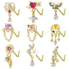 six pairs of gold tone metal earring with colorful crystal stones and dangling hooks on each side