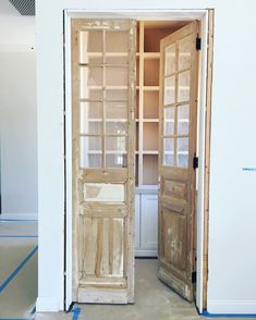 an open door in a room with white walls