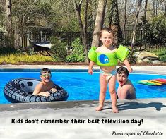 two boys and a girl are playing in the pool with an inflatable raft