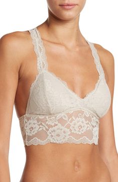 A sultry floral lace bralette with a back cutout offers a sophisticated style that can be worn as bold standout piece or a supportive underwear. V-neck Shell: 86% rayon, 14% spandex; lining: 95% polyester, 5% spandex Hand wash, dry flat Imported Lace Camisole With Removable Bra Pads, Bra Friendly Lace Camisole, Elegant Fitted Bra With Lace Top, Elegant Seamless Backless Bra, Elegant Lace Bra With Lace Top, Chic Camisole With Removable Bra Pads, Seamless Lace Top, Chic Lace Bra With Lace Trim, Elegant Spring Bra With Delicate Lace