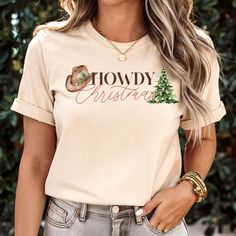 CHECK OUT OUR MATCHING SWEATSHIRT IN OUR SHOP! It's Cowboy Christmas season y'all! Embrace your inner country cowgirl and cowboy in this festive tee! Dressed up for work, dressed down for festive holiday pajamas, this shirt can do it all! Gift to you favorite cowgirl or cowboy.  Care instructions: Machine wash: cold (max 30C or 90F) Non-chlorine bleach as needed Tumble dry: low heat Do not iron Do not dry clean No Returns or Exchanges. Thank you so much for supporting our small business! Country Cowgirl And Cowboy, Cow Boys, Country Cowboy, Family Pjs, Country Cowgirl, Western Graphic Tees, Cowboy Christmas, Cowgirl Shirts, Matching Sweatshirts