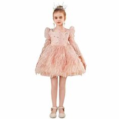 Indulge your little one in the ultimate luxury with the Dreamy Vow Pink Arabic Girl Dress. Designed with intricate sequins, this dress will make her feel like a true princess on her special day. Perfect for birthdays, weddings or any holiday, this gown will make her stand out in style. Princess Pageant Ball Gown In Glitter Tulle, Embellished Tulle Princess Dress For Pageant, Embellished Princess Dress For Dress-up, Long Sleeve Sequin Princess Dress For Dress-up, Princess Style Long Sleeve Pageant Dress, Princess Style Pageant Dress In Glitter Tulle, Princess Ball Gown Dress In Glitter Tulle, Princess Style Embellished Pageant Dress, Princess Ball Gown In Glitter Tulle