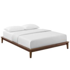 an image of a bed with white sheets and pillows on the headboard or foot board